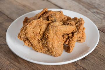 Fried chicken on a white plate.