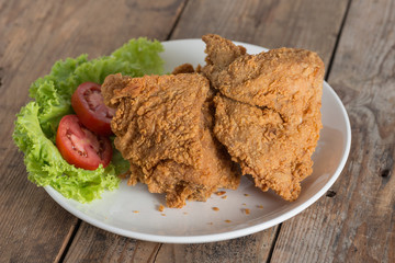 Fried chicken on a white plate.