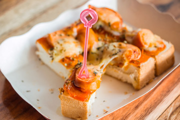 Toast homemade pizza split slices are good.Selective focus used.