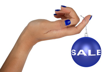 Woman's hand holding a christmas sales bauble
