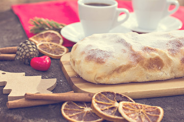 Strudel with custard and orange. Christmas Stollen. Christmas table decoration.