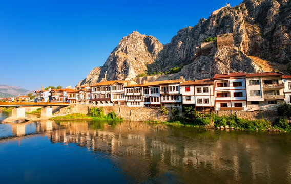 Traditional ottoman houses reflecting in the river, Amasya, Turkey