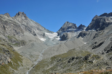 Fototapeta na wymiar The Haute Route with the Bertol Refuge on the ridge, in the Swiss Alps