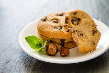 Chocolate chip cookies on white plate
