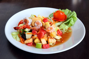 Spicy fruit salad with prawns in thai style - som tum
