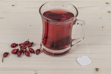 rose hip tea on wooden table