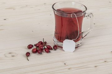 rose hip tea on wooden table