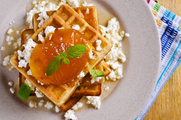 Waffles with jam and ricotta