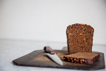  black bread with sunflower seeds on cutting board