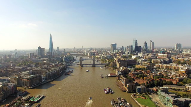 4K The New London Skyline Modern Buildings Aerial Video with Tower Bridge, New The Shard, City Hall, Cheesegrater, Gherkin and Walkie Talkie Buildings and Thames River in a Sunny Day