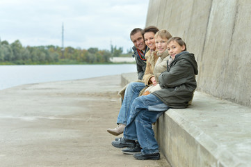 Family at river embankment