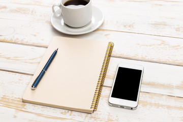 Opened notebook and other office equipment