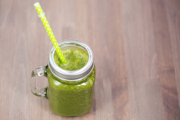 A green smoothie in a mason jar