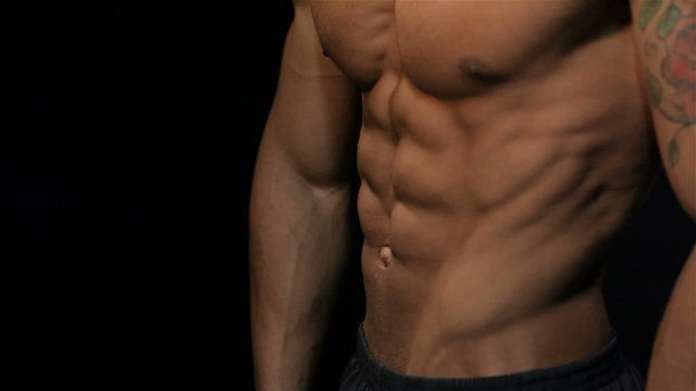 Close up man showing a perfect ABS