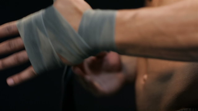 Man pulls the belt on the hand side view