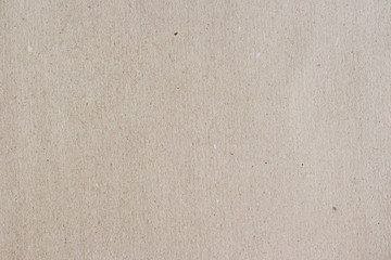 Carton texture. Beige paperboard sheet as background.