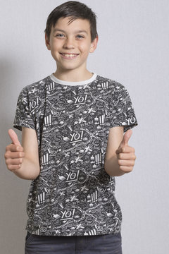 Portrait of Young Boy With Thumbs Up Gesture