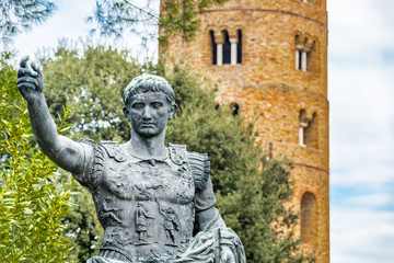 Fototapeta na wymiar Caesar Augustus statue overlooking bell tower