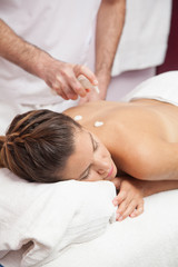 Obraz na płótnie Canvas Young woman gets a special massage 