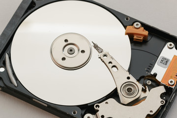 Notebook hard drives on the background.