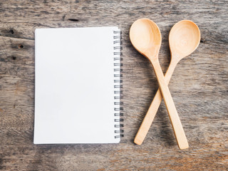 Notepad and two wooden spoons