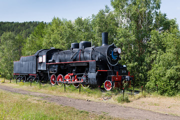Fototapeta na wymiar Steam machine on train station. Shore of Lake Baikal (Russia)