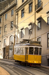 Old yellow tram in the streets of Lisbon, Portugal