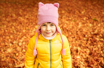 happy little girl in autumn park