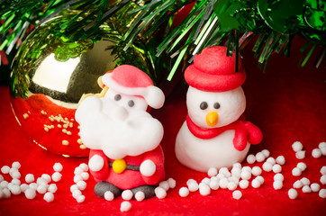Christmas decoration, santa claus and snowman doll on the snow
