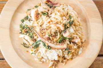 Rice topped with stir-fried squid basil (Thai food)