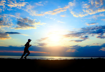 Fototapeta premium Man running at Sunset
