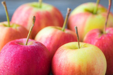 Apples on old wooden background.