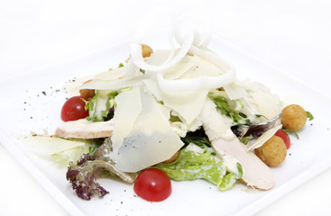 salad vegetables and goat cheese on a white background