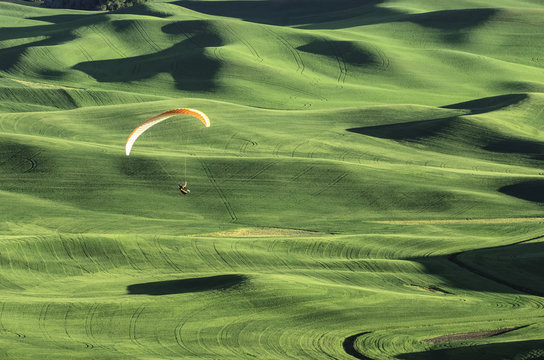Paraglider over hills of The Palouse, Washington, USA