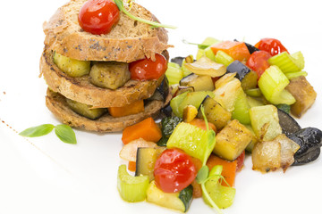 steamed vegetables, tomatoes celery eggplant with rye rolls