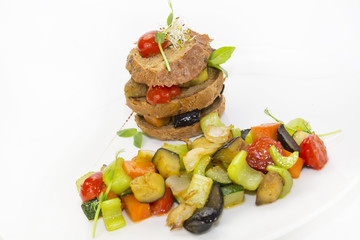 steamed vegetables, tomatoes celery eggplant with rye rolls
