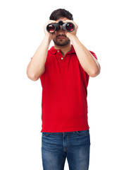 man looking throught binoculars