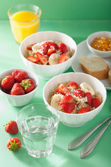 healthy breakfast quinoa with strawberry banana coconut flakes