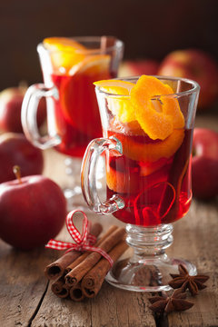 glass of mulled wine with orange and spices, winter drink