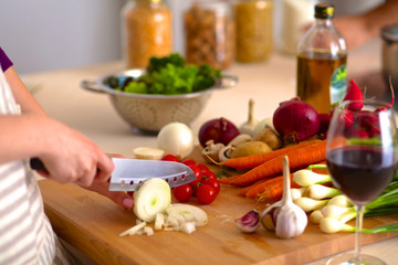 Young Woman Cooking in the kitchen. Healthy Food
