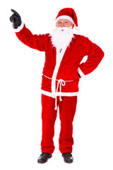 Christmas Santa Claus full length portrait. Pointing at copyspace. Isolated on White Background
