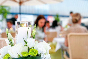 People in cafe talking and having dinner or drinking coffee. Blurred background. Toned image instagram style.
