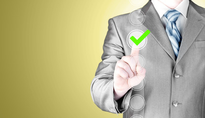 business man touching, pressing modern button with green ticking Check Box