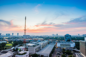Fototapeta premium Bangkok cityscape with communication tower at twilight, Thailand
