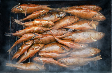 Fresh hot smoked fish on the grill