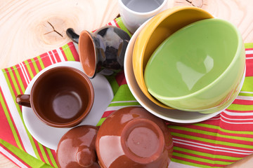 plates and cups on wooden table