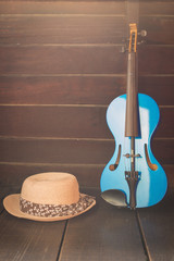 Modern violin on the wooden background. (Still Life Style)