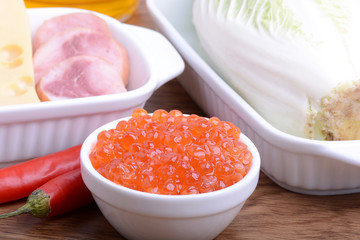 Food high in protein, sausages, cheese, red pepper, red caviar, cabbage