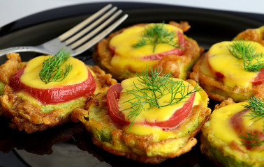 appetizer of  zucchini tomato and cheese