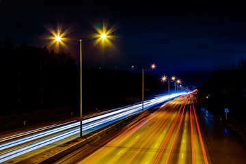 Highway at night with the lights from cars